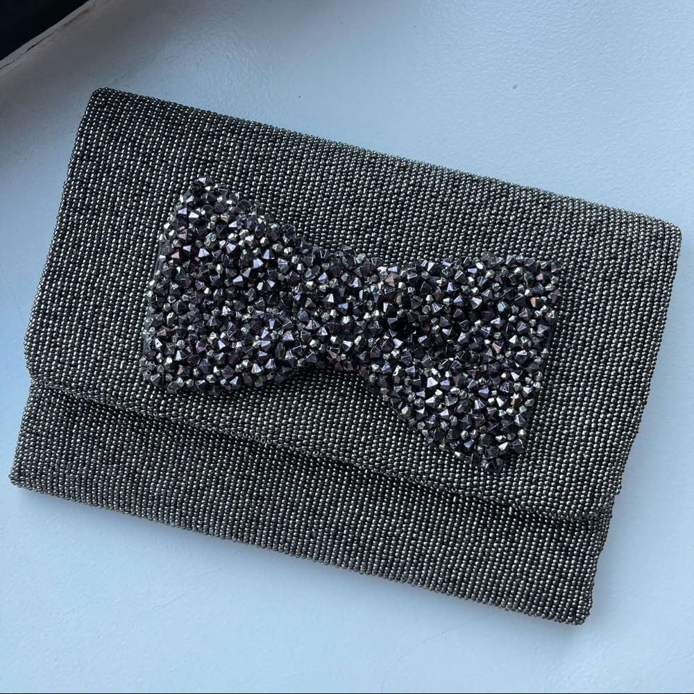 silver beaded bow clutch